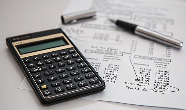 Calculator, Pen, and Tax Documents
